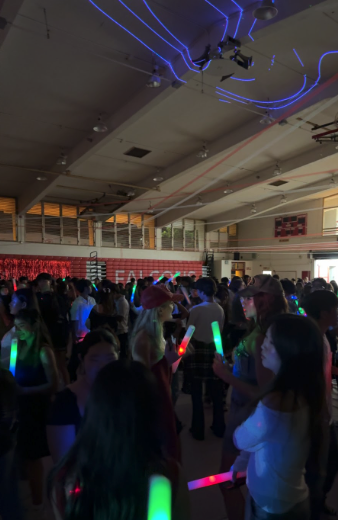 Dance battles were the big theme of Kalani’s Homecoming dance, held at the start of Homecoming Week on Saturday, Sept. 28. Everyone had their light-up sticks and dresses and mosh-pits. Seven Kalani clubs had food stalls before the dance, from 5 to 6 p.m. in the school's cafeteria, selling everything from milk tea to Spam musubi to pizza. The Varsity football team played Castle at the end of the week and lost 42 to 21.  Photo by Naomi Sullivan. 